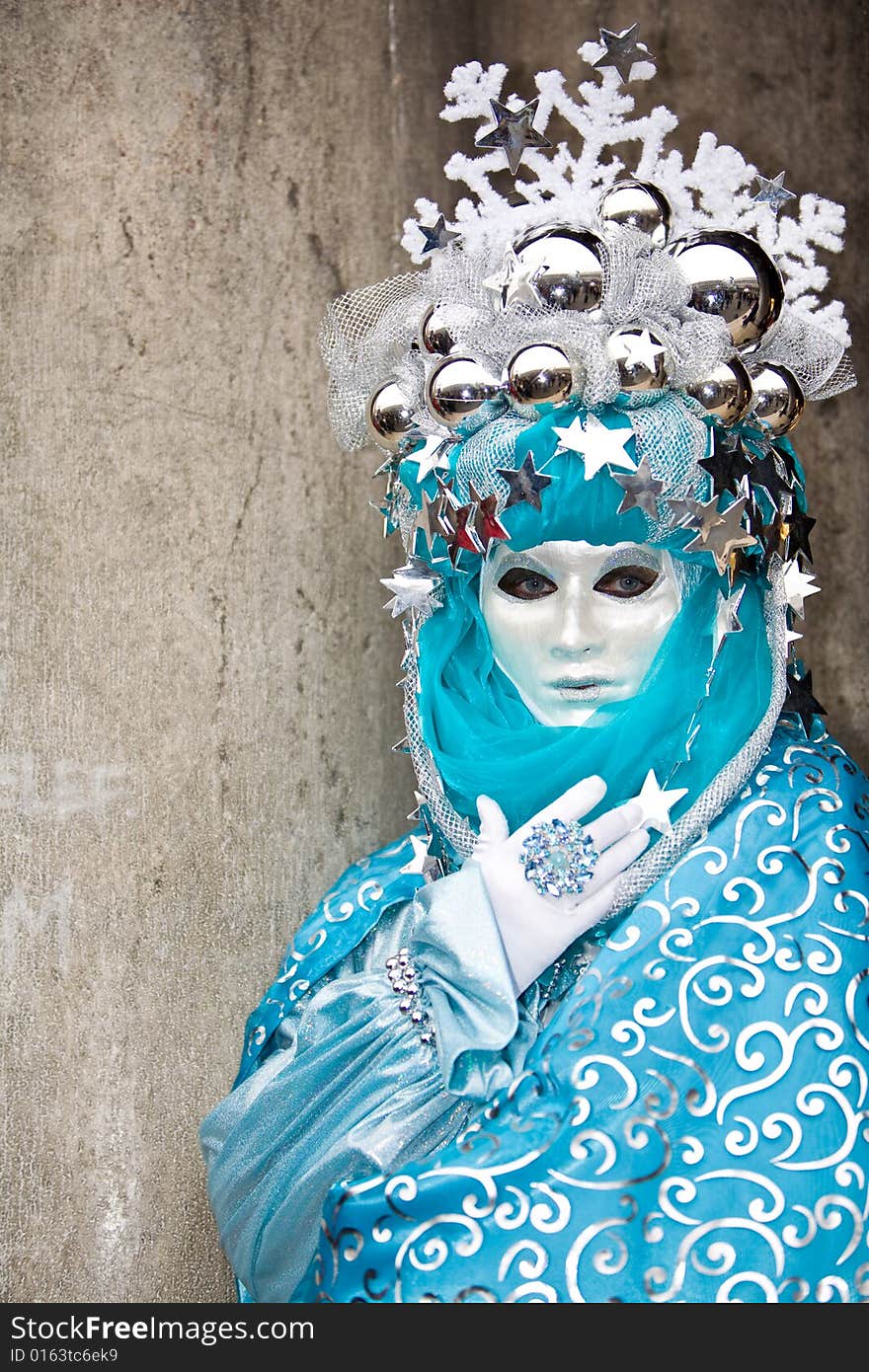 Turquoise and silver costume at the Venice Carnival. Turquoise and silver costume at the Venice Carnival