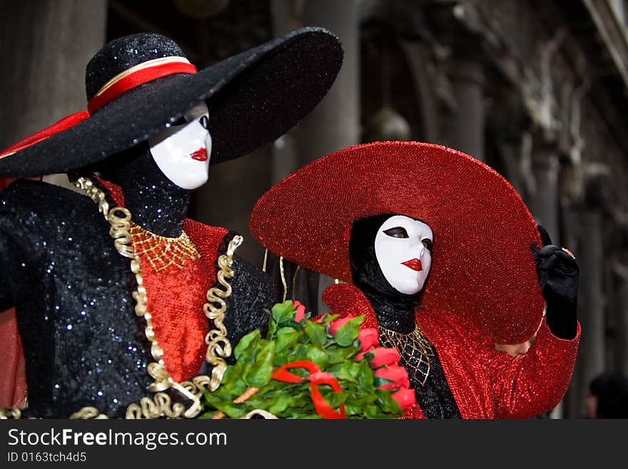 Red and black costume at the Venice Carnival. Red and black costume at the Venice Carnival