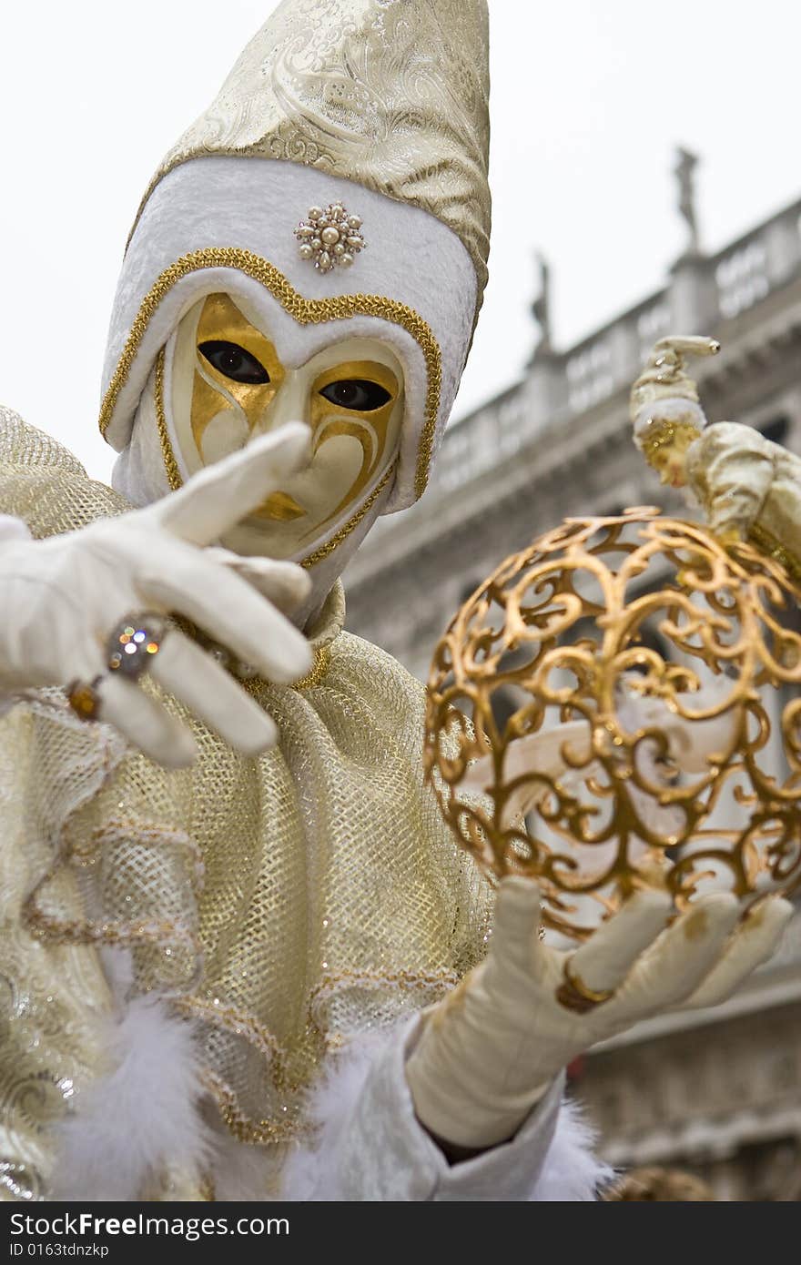 White and gold costume at the Venice Carnival. White and gold costume at the Venice Carnival