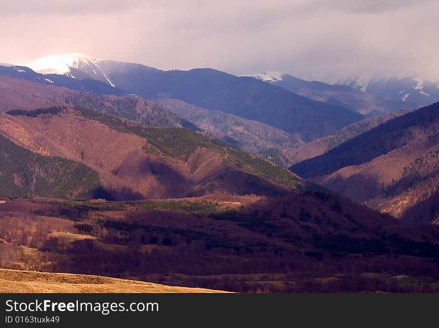 Mountain scenery with high hills - brown,green colors. Mountain scenery with high hills - brown,green colors.