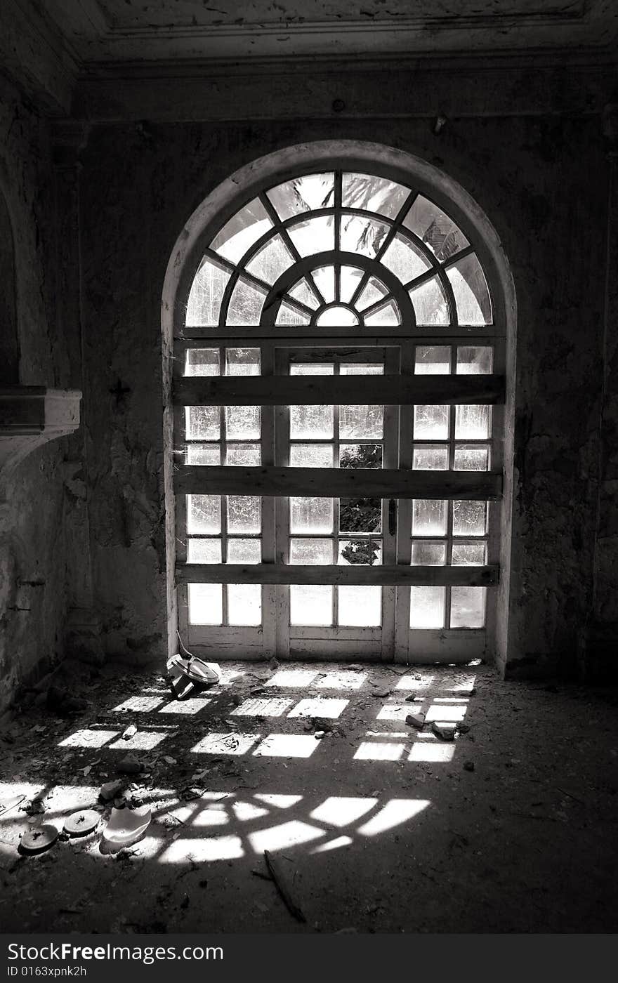 Door window entrance in an abandoned hotel after the war in Croatia