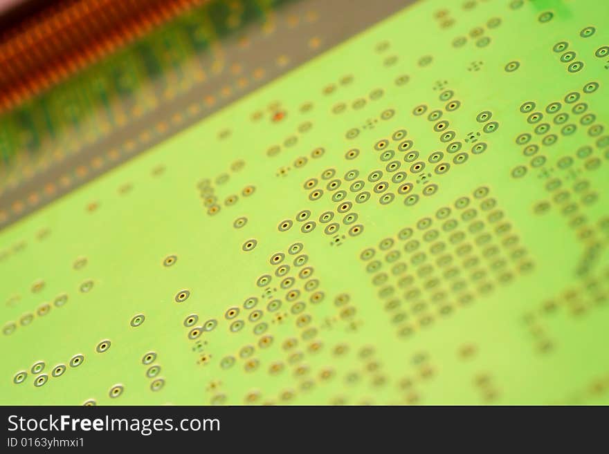 Green circuit board without components.