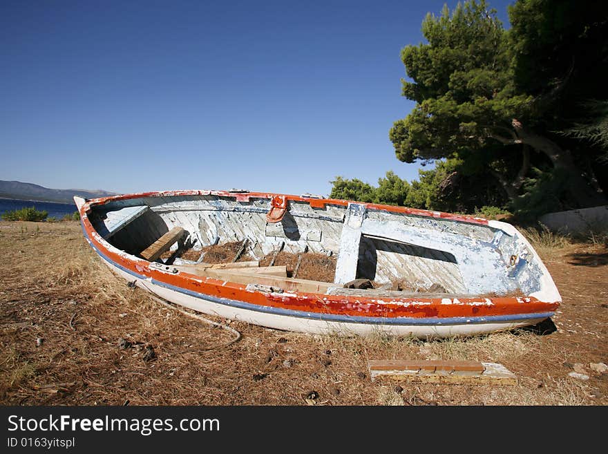 Old fishing boat abandoned on the beach,croatia