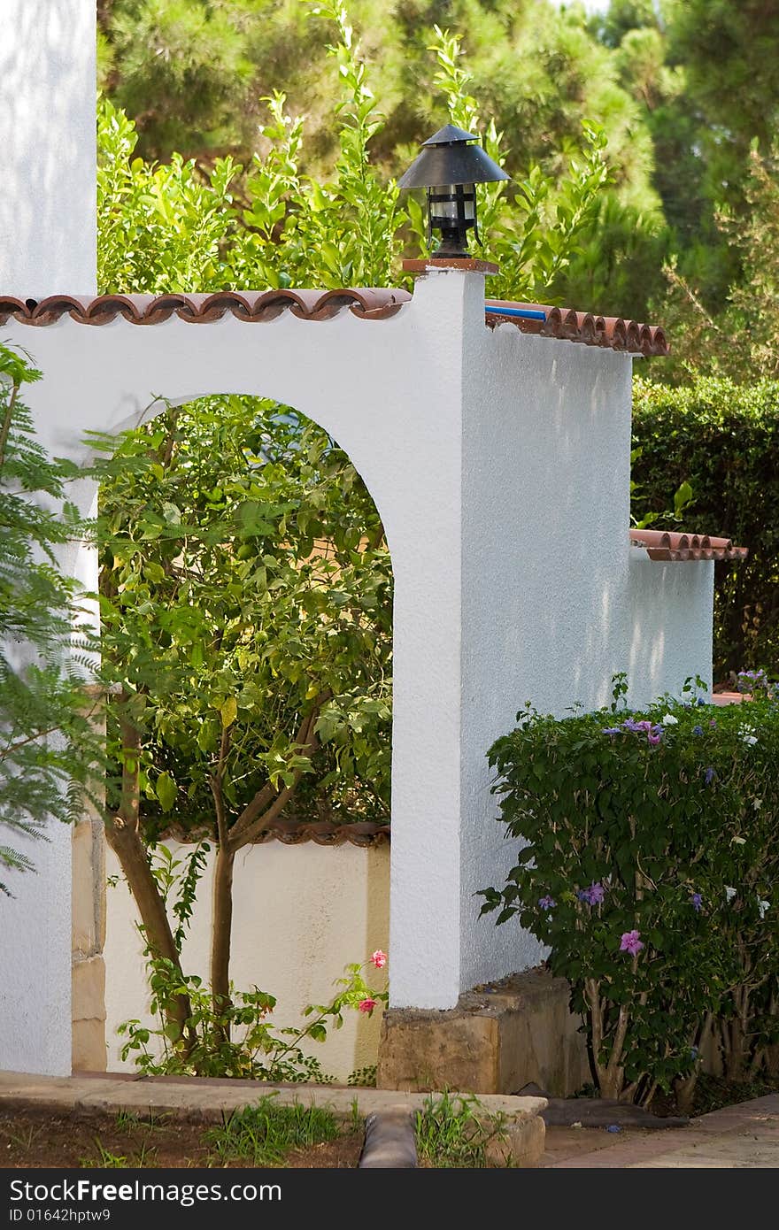 Beautiful white arch on a background of trees