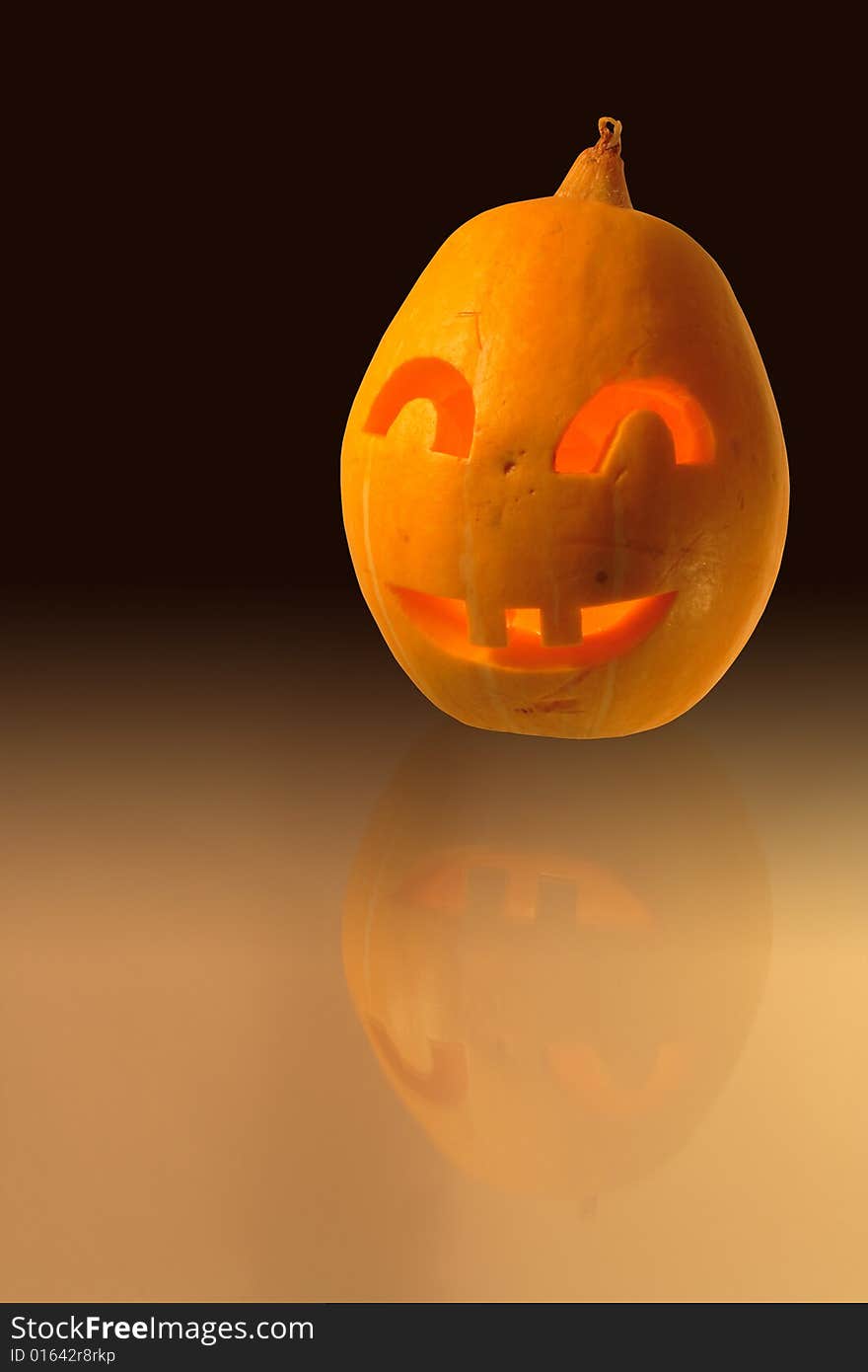 Halloween close-up of jack-o'-lantern head on dark background. Halloween close-up of jack-o'-lantern head on dark background