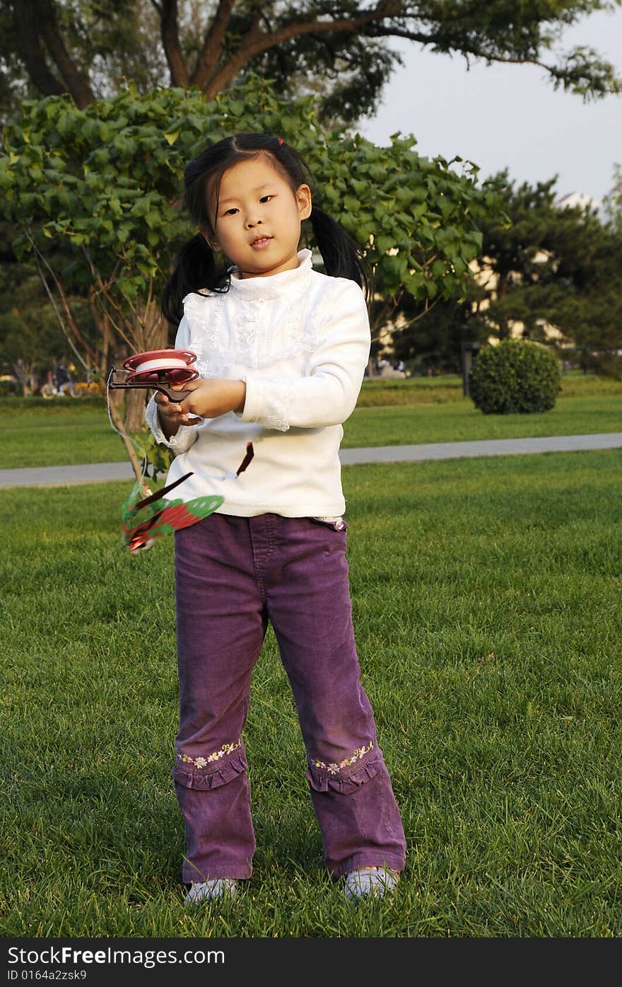 Chinese girl play kite, fly kite