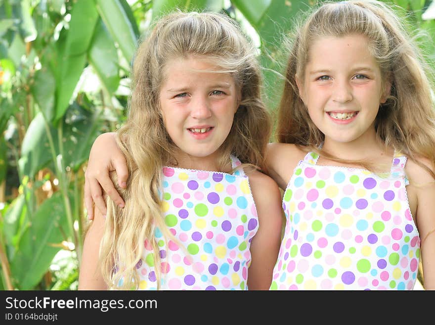 Shot of identical twin beautiful sisters