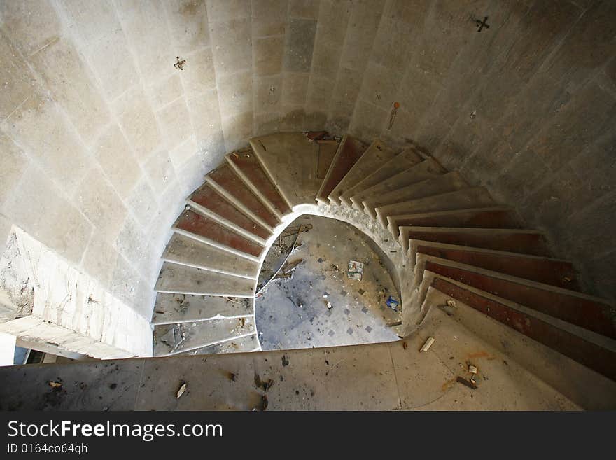 Spiral staircase in an abandoned hotel