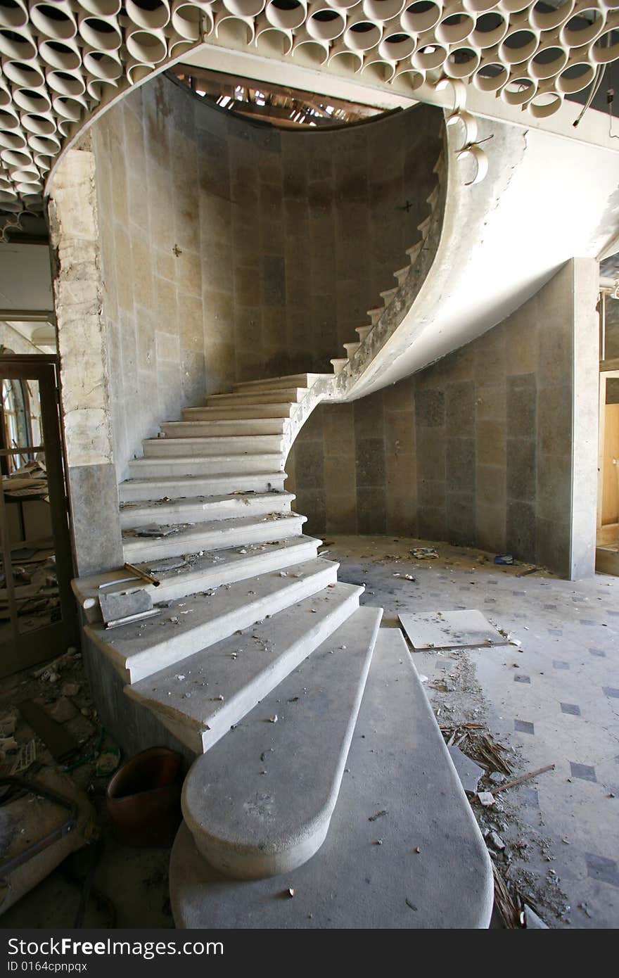 Spiral staircase in an abandoned hotel