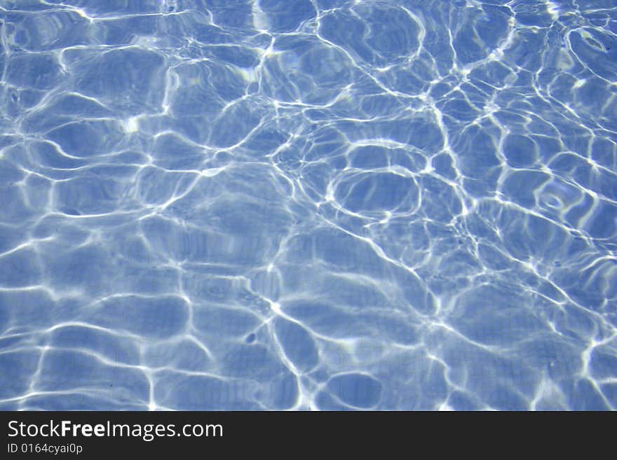 Sunlight reflection in clear blue pool. Sunlight reflection in clear blue pool