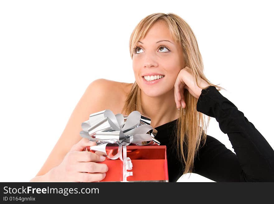 Beautiful girl with  gift  looks up