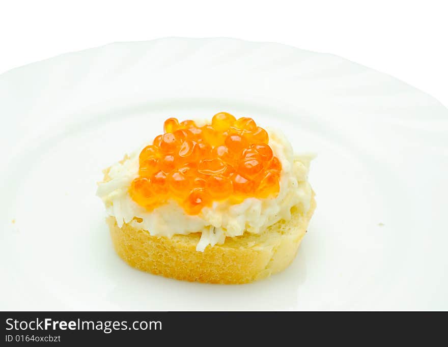 Caviar sandwich on white plate, isolated on white