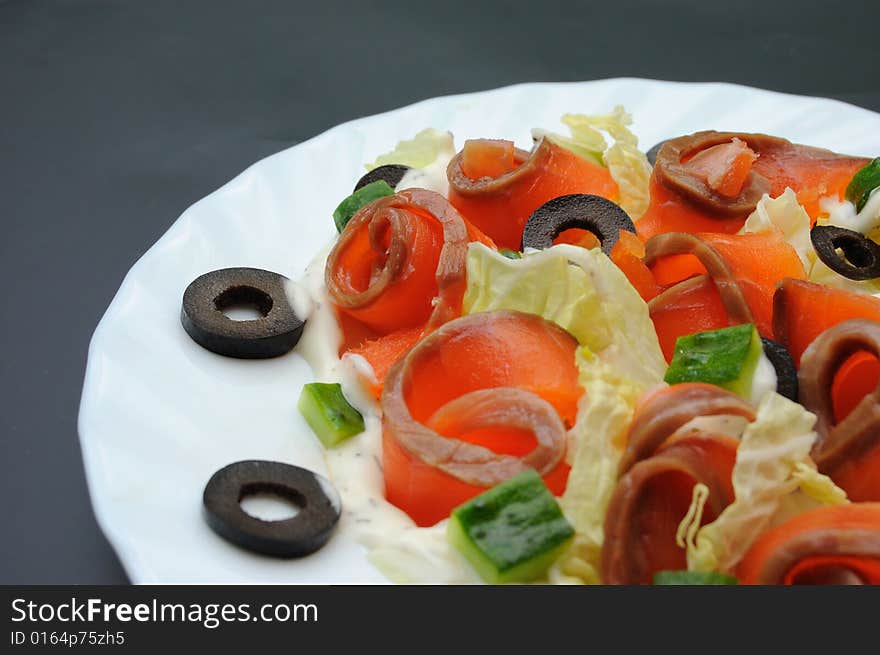 Salmon salad on white plate