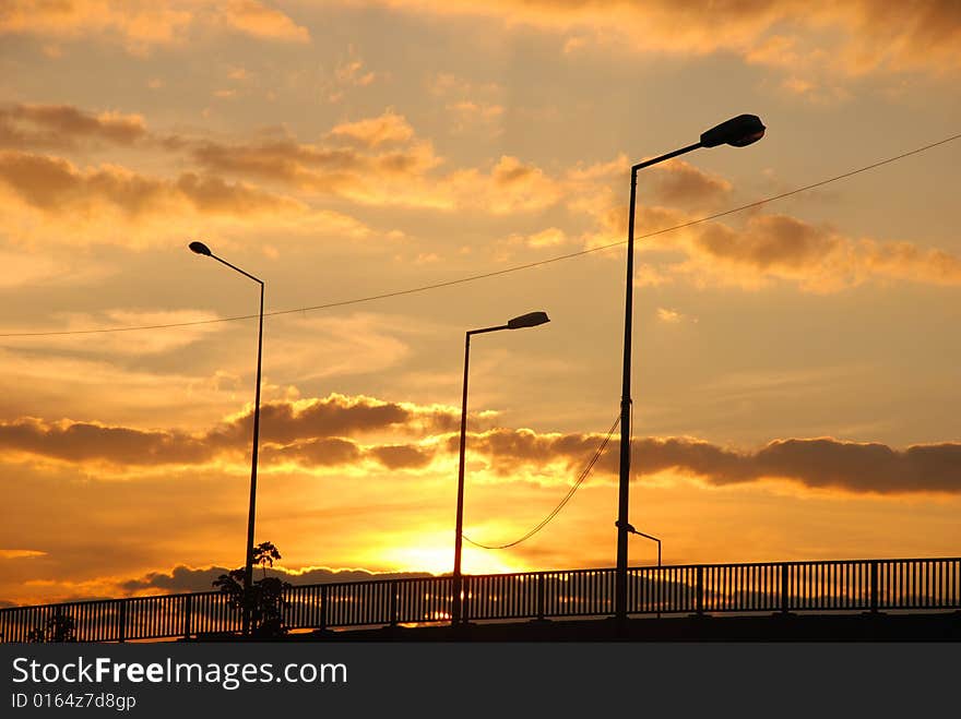 Silhouettes of bridge and electricity poles at the dusk. Silhouettes of bridge and electricity poles at the dusk