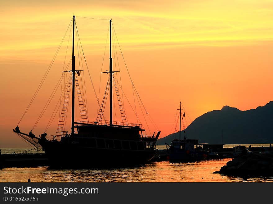 Ship silhouette after sunset  and red sky