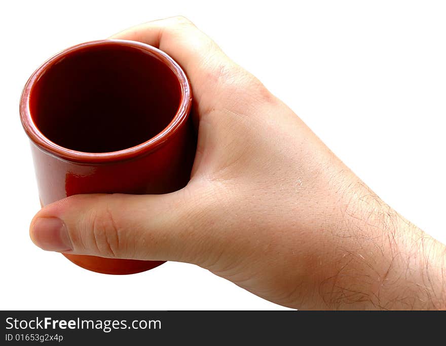 Pottery cup for tea or coffee in man's hand on isolated background. Pottery cup for tea or coffee in man's hand on isolated background.