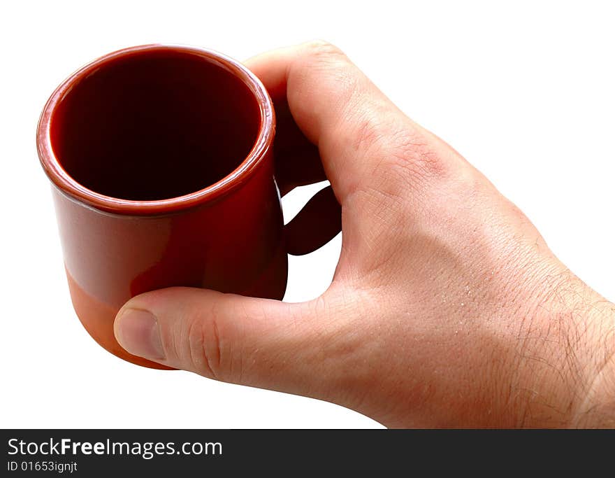 Pottery cup for tea or coffee in man's hand on isolated background. Pottery cup for tea or coffee in man's hand on isolated background.