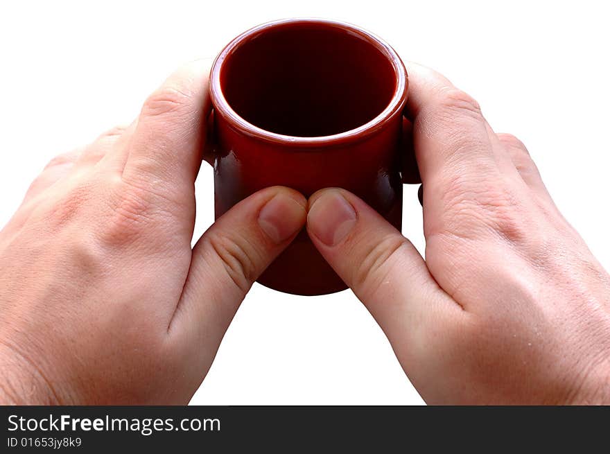 Pottery cup for tea or coffee in man's hands on isolated background. Pottery cup for tea or coffee in man's hands on isolated background.