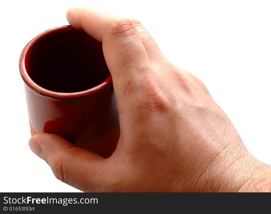 Pottery cup for tea or coffee in man's hand on isolated background. Pottery cup for tea or coffee in man's hand on isolated background.