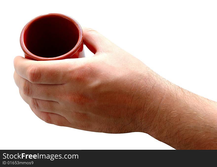 Pottery cup for tea or coffee in man's hand on isolated background. Pottery cup for tea or coffee in man's hand on isolated background.