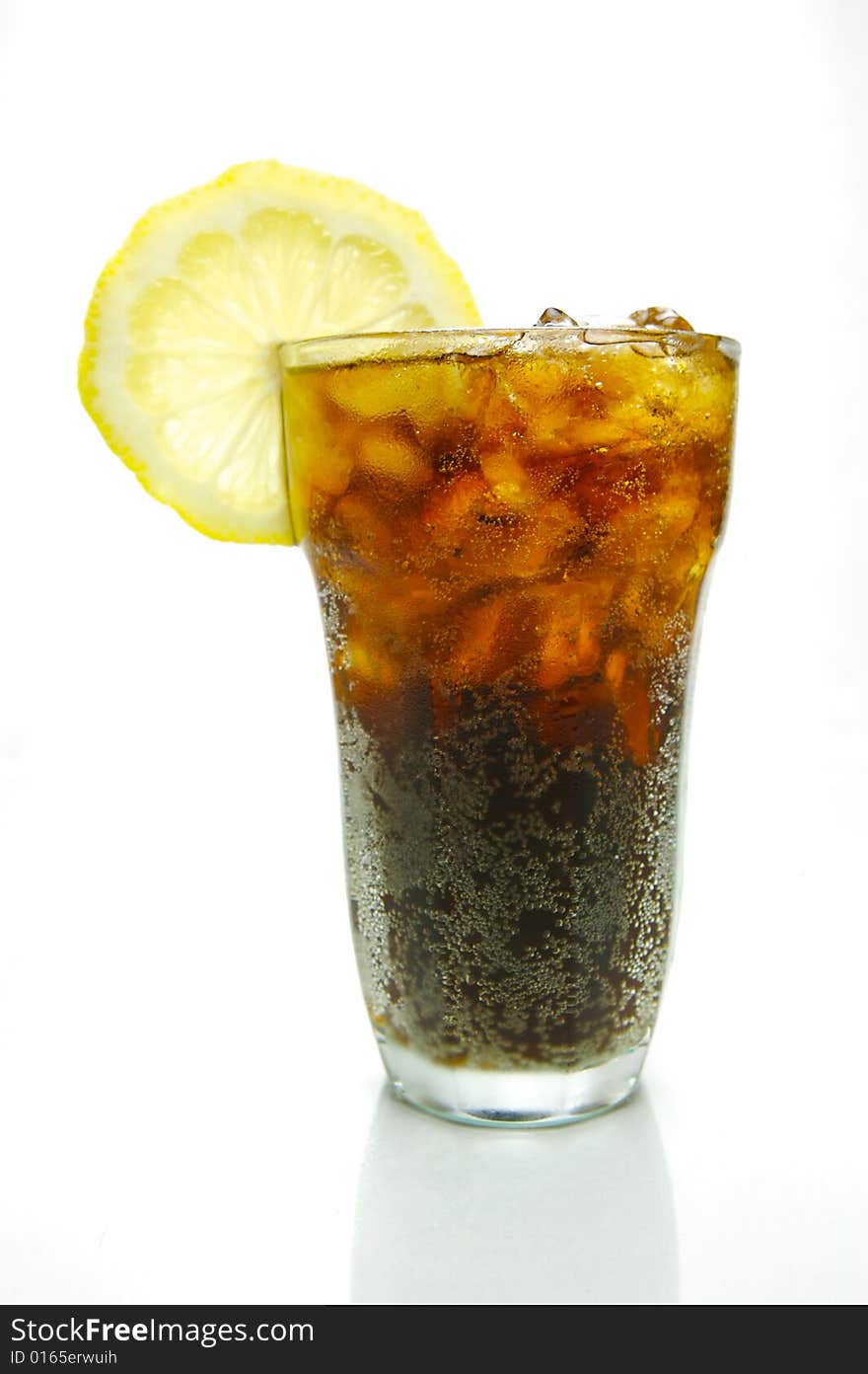 A glass of lemon cola isolated against a white background