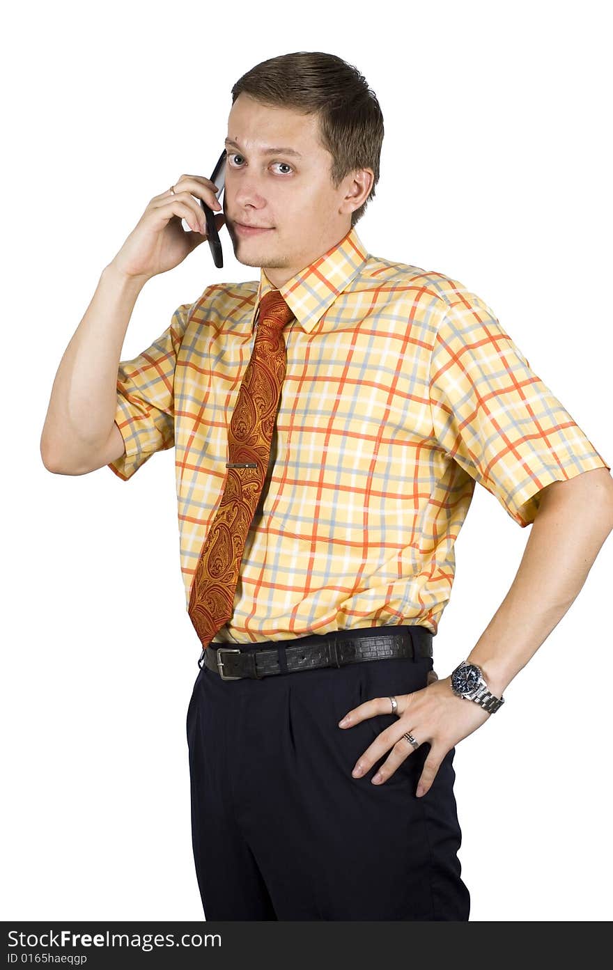 Young, elegant European businessman, wearing suit, shirt and tie. Smiling friendly. Talking on mobile phone. Young, elegant European businessman, wearing suit, shirt and tie. Smiling friendly. Talking on mobile phone.