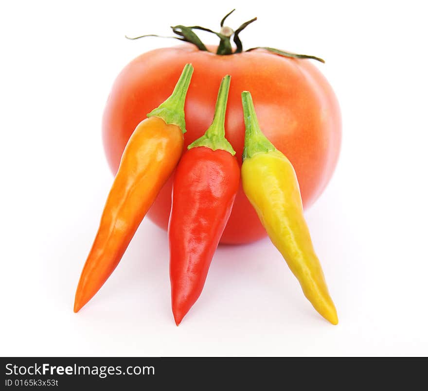 Chillies and Tomato on a white background