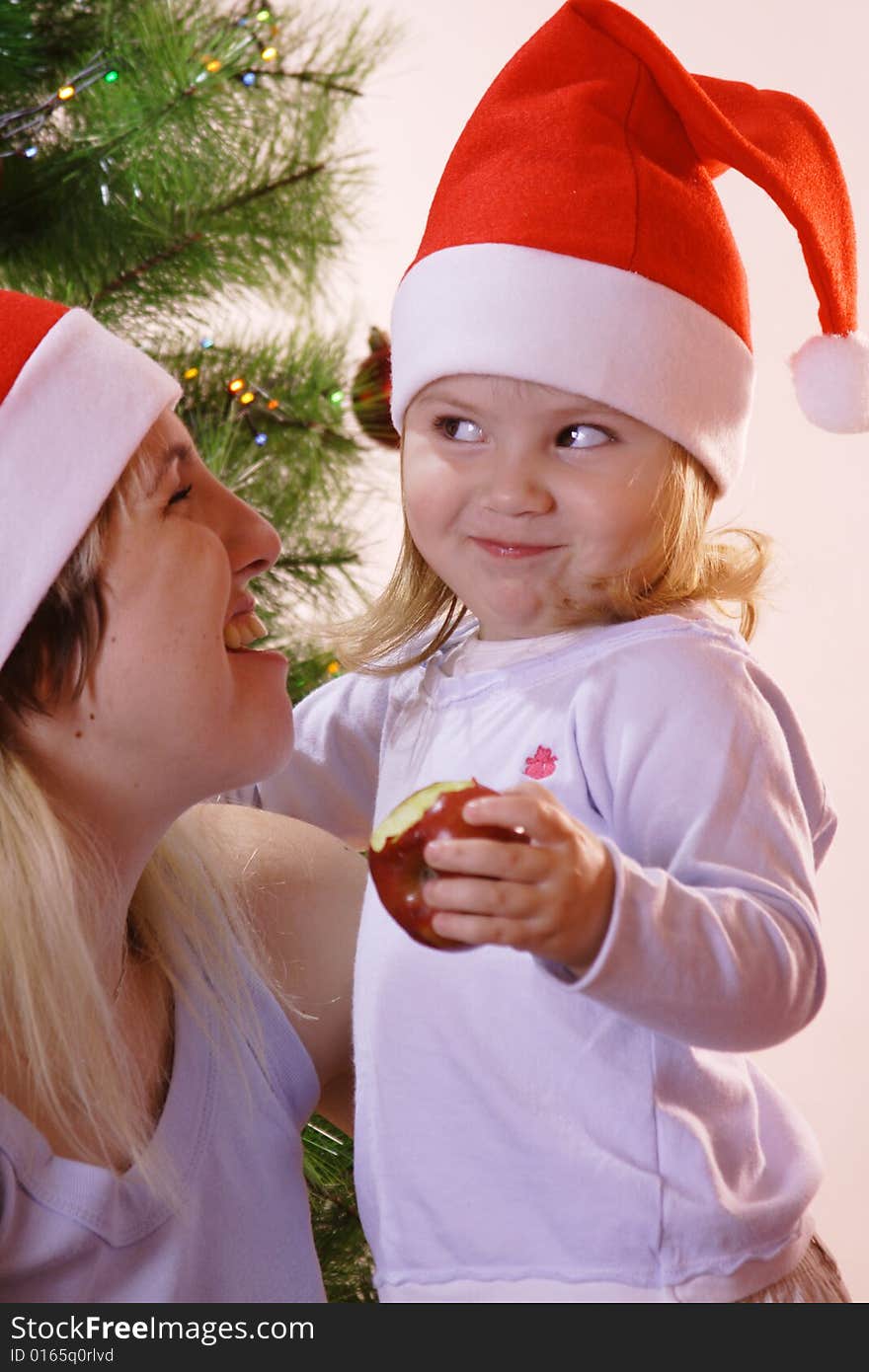 Mother and daughte near christmas tree. Mother and daughte near christmas tree