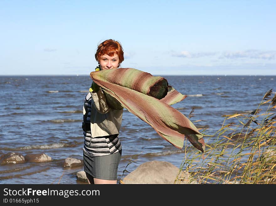 Red haired woman with scarf.