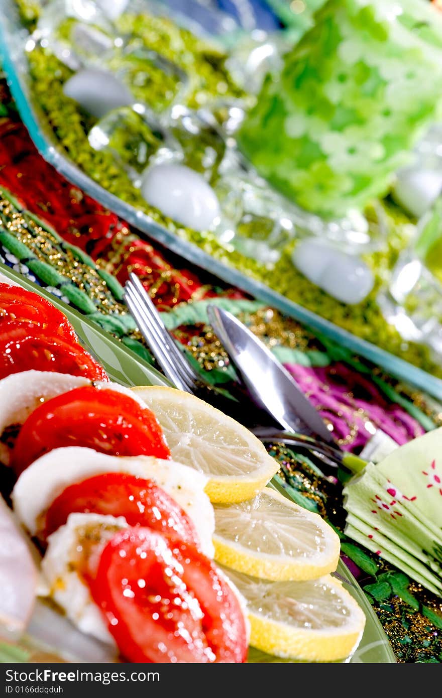 Tasty tomato mozzarella salad dish and some salad dressing. Tasty tomato mozzarella salad dish and some salad dressing