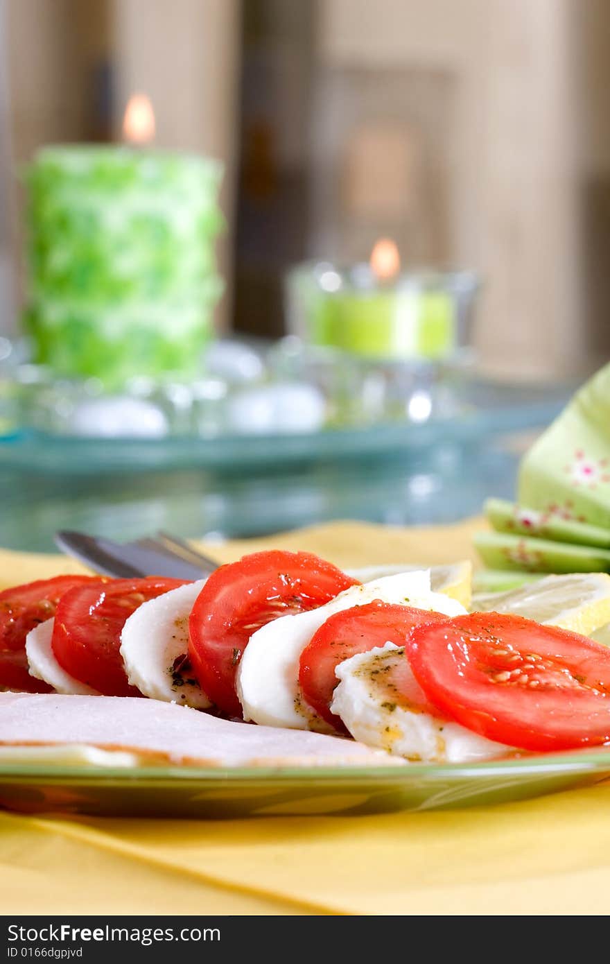 Tasty tomato mozzarella salad dish and some salad dressing. Tasty tomato mozzarella salad dish and some salad dressing