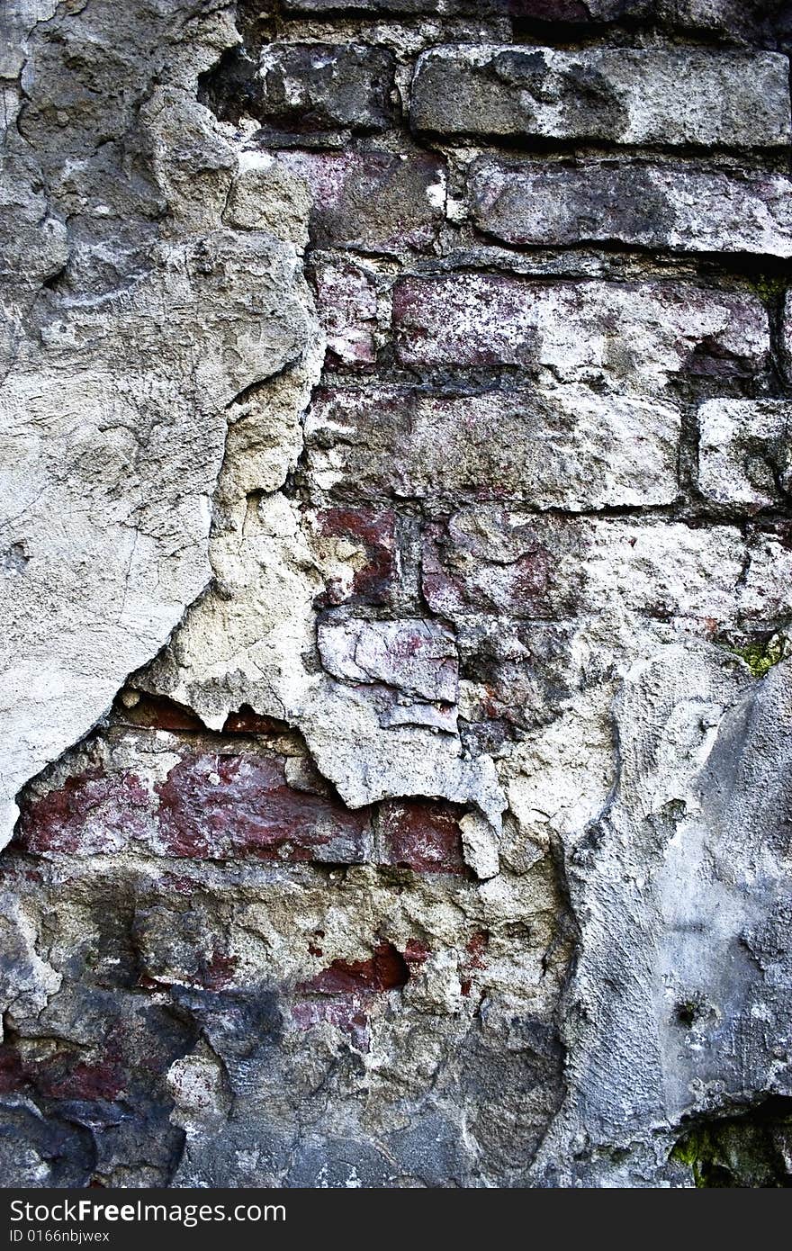 Texture of an old brick wall with cracks