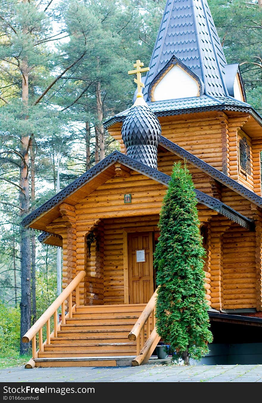 The wooden orthodox church in the forest