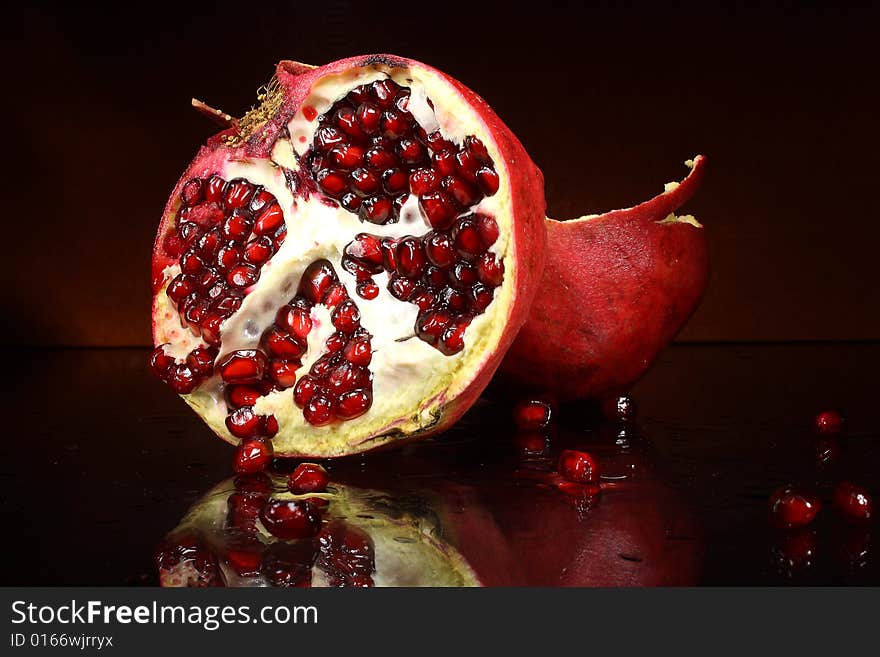 Photo red fruit grenades on a dark background. Photo red fruit grenades on a dark background