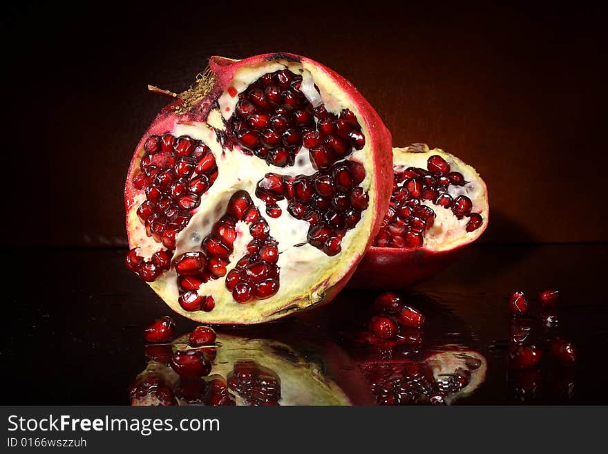 Photo red fruit grenades on a dark background. Photo red fruit grenades on a dark background