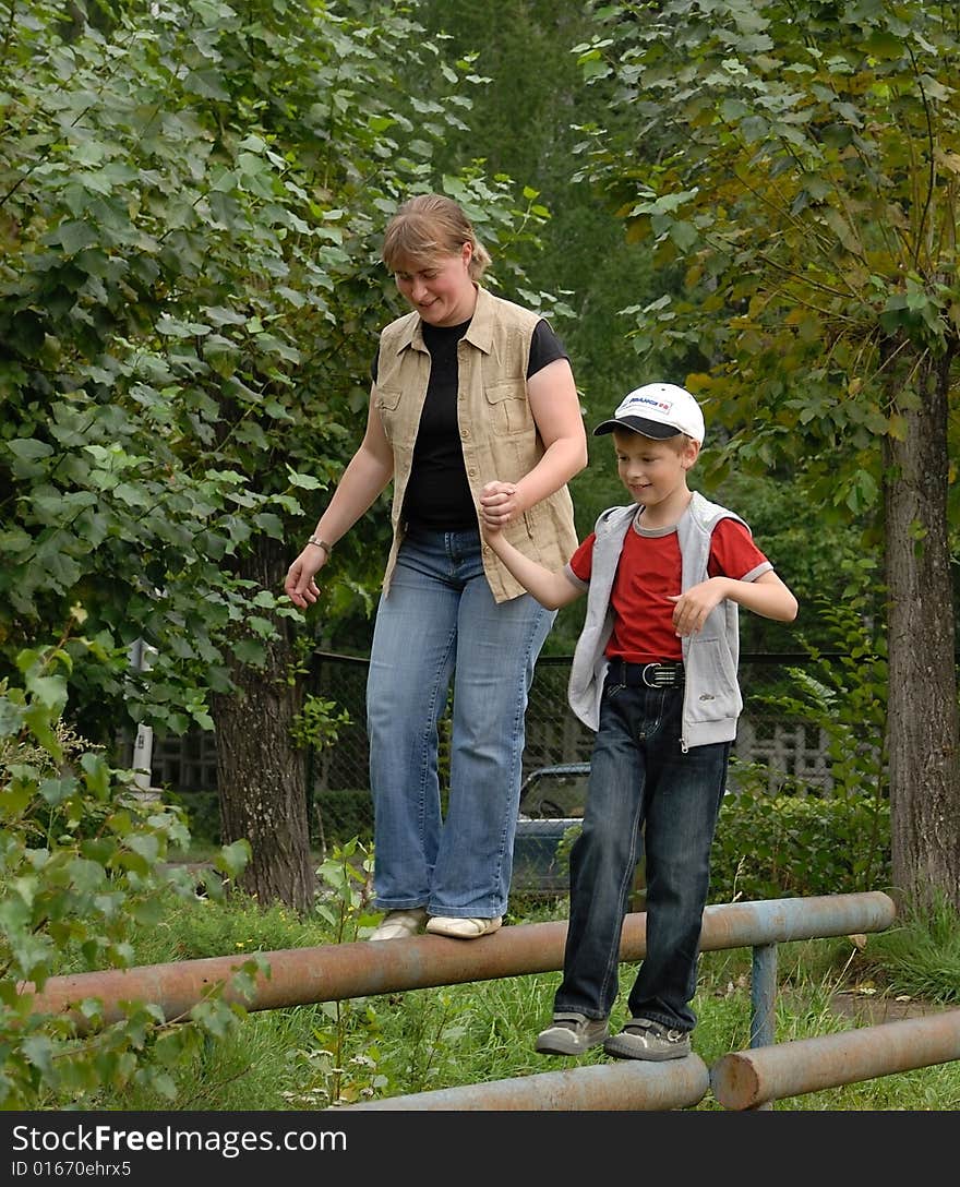 Boy with mother outdoor sports