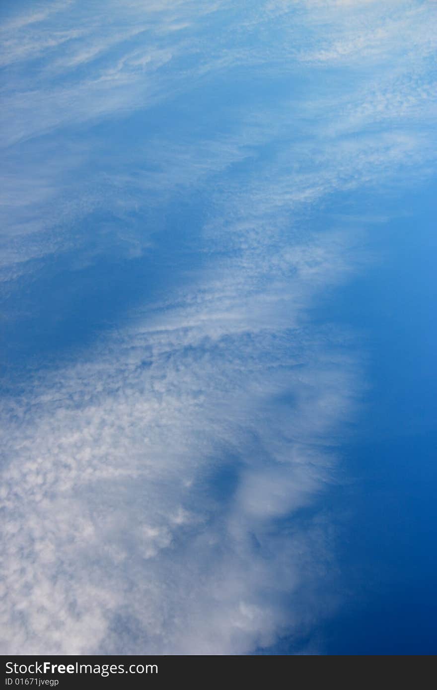 The dark blue sky and white clouds. The dark blue sky and white clouds