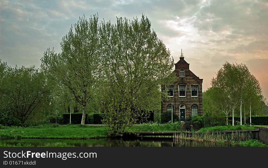 Old house next to the channel. Old house next to the channel