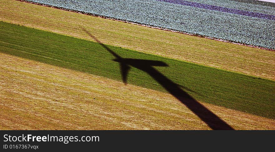 Wind turbin shadow on the field