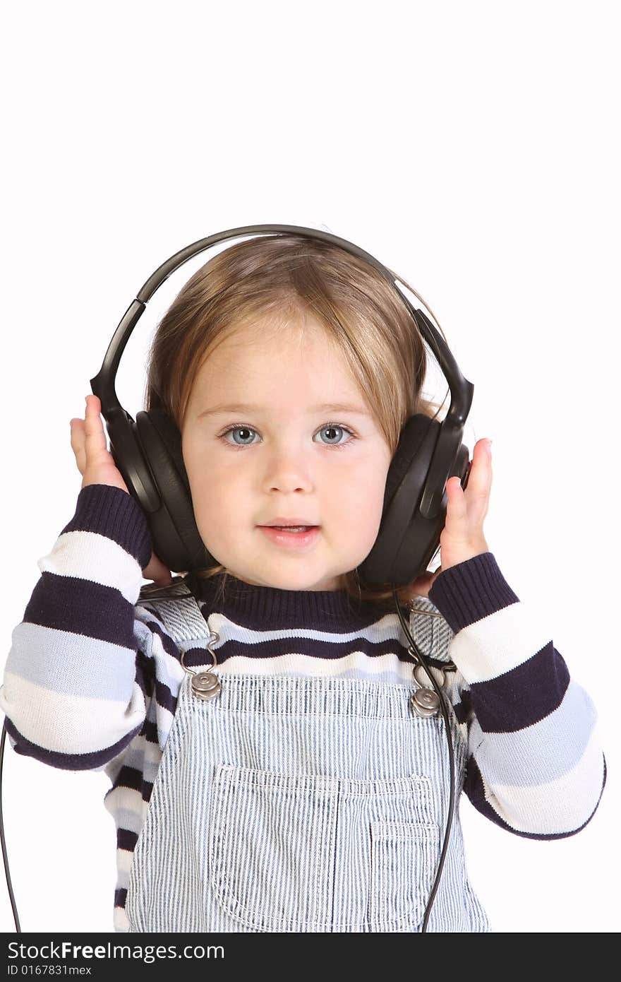 Beauty a little girl listening music on white background