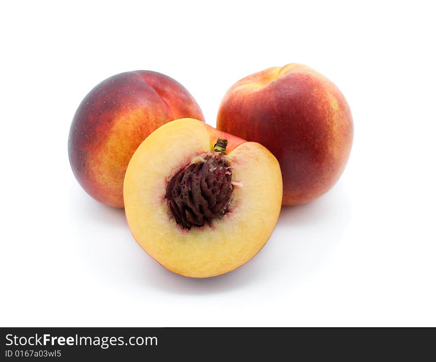 Three peaches  on white background.