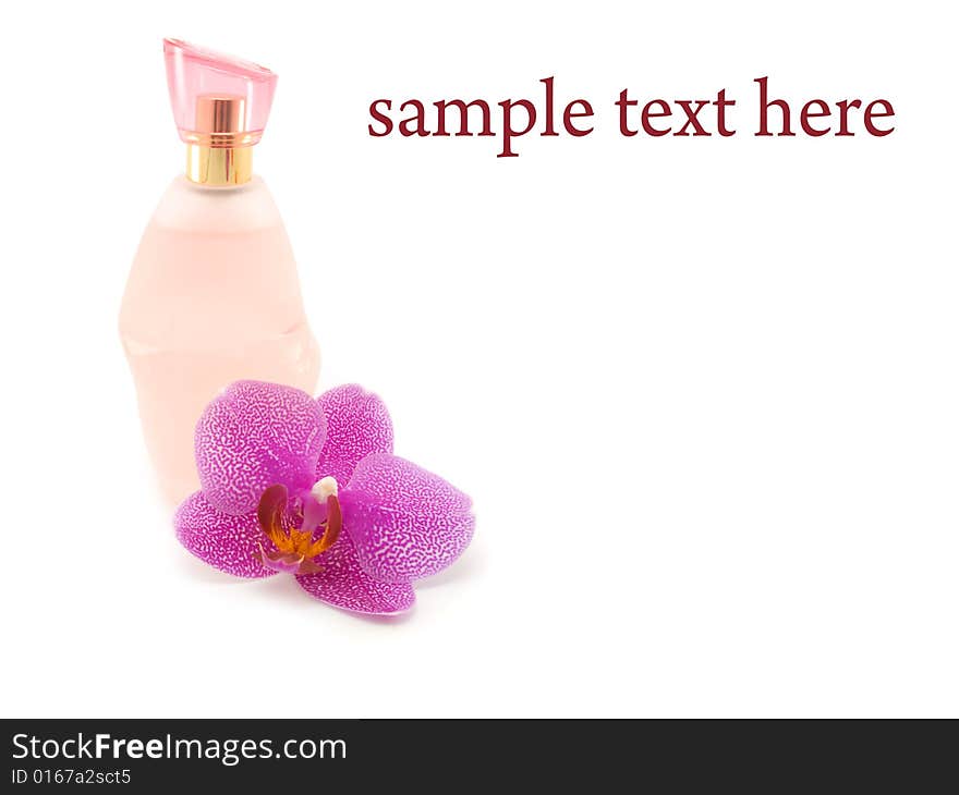 Bottle of perfume and orchid