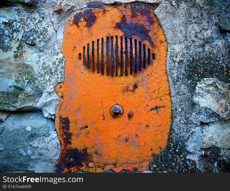 Old door bell in the wall