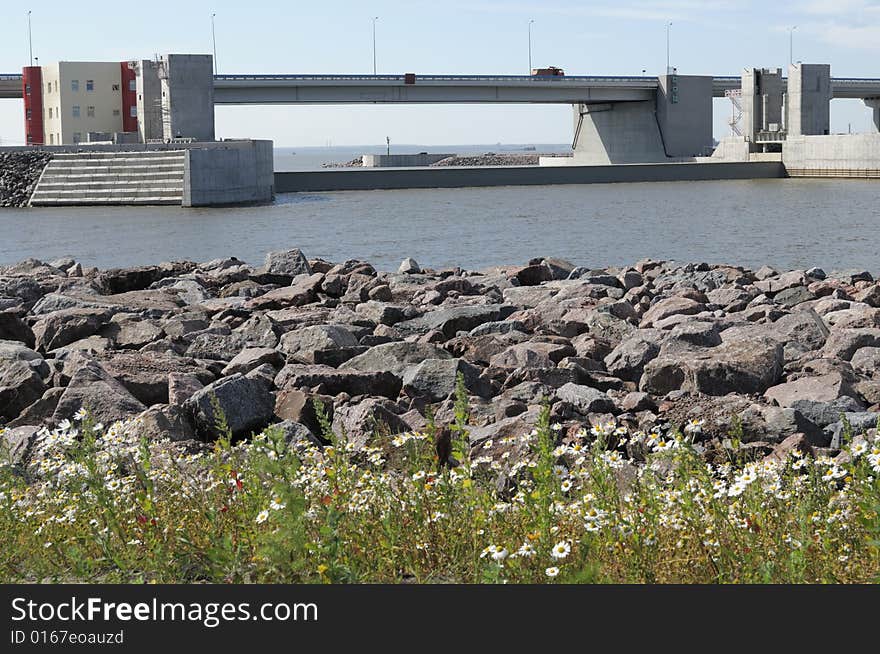 Site of a dam with the lifted valve interfering passage of water. Site of a dam with the lifted valve interfering passage of water.