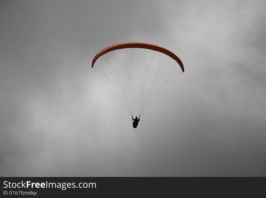 Glider flies over mountains in clouds. Glider flies over mountains in clouds