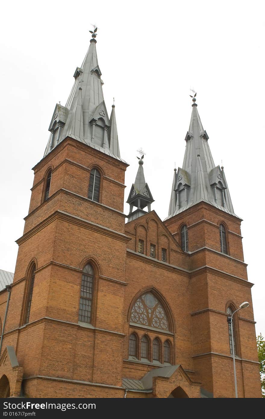 A red church against the white sky