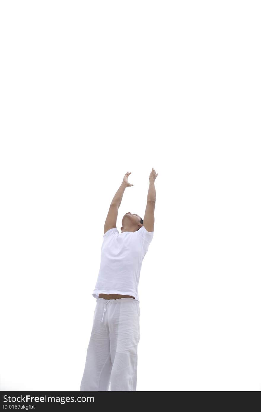 A young man practicing yoga outdoors. A young man practicing yoga outdoors