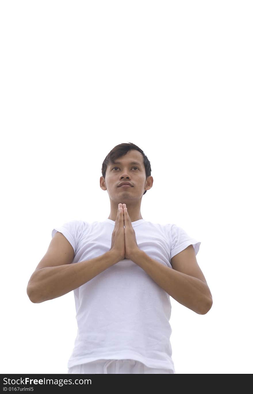 A young man practicing yoga outdoors. A young man practicing yoga outdoors