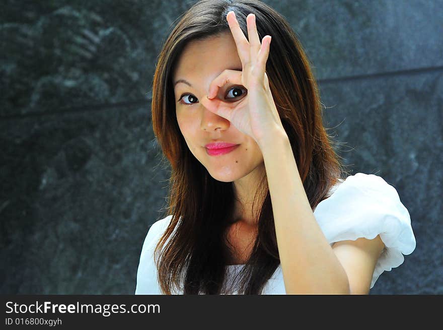 Asian Girl doing common hand gestures. Suitable for different meanings. Smiling Sheepily... Lazy way of smiling... Half drunk. Asian Girl doing common hand gestures. Suitable for different meanings. Smiling Sheepily... Lazy way of smiling... Half drunk.