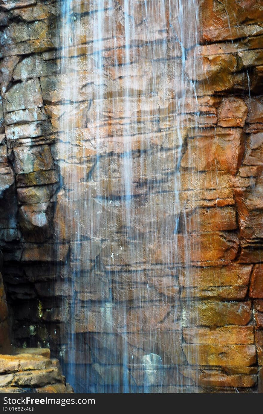 This is a shot of a man made waterfall at a local water park.